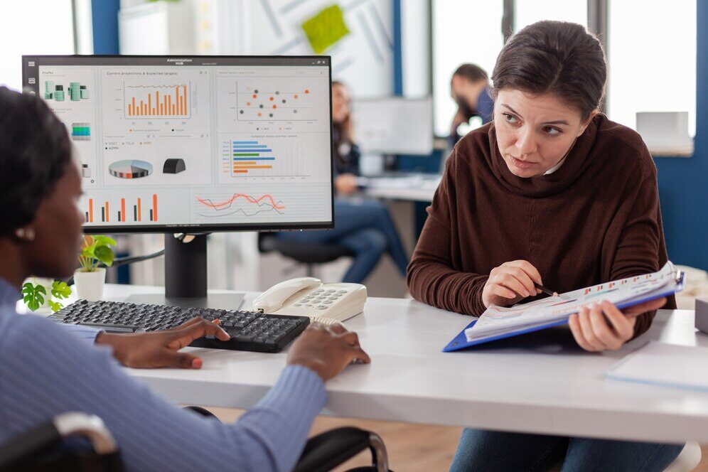 businesswomen-planning-financial-strategy-looking-computer-working-together-start-up-company-officet